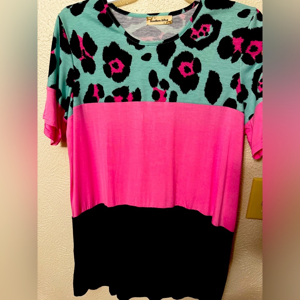 Women’s assorted tops and dresses in excellent condition.